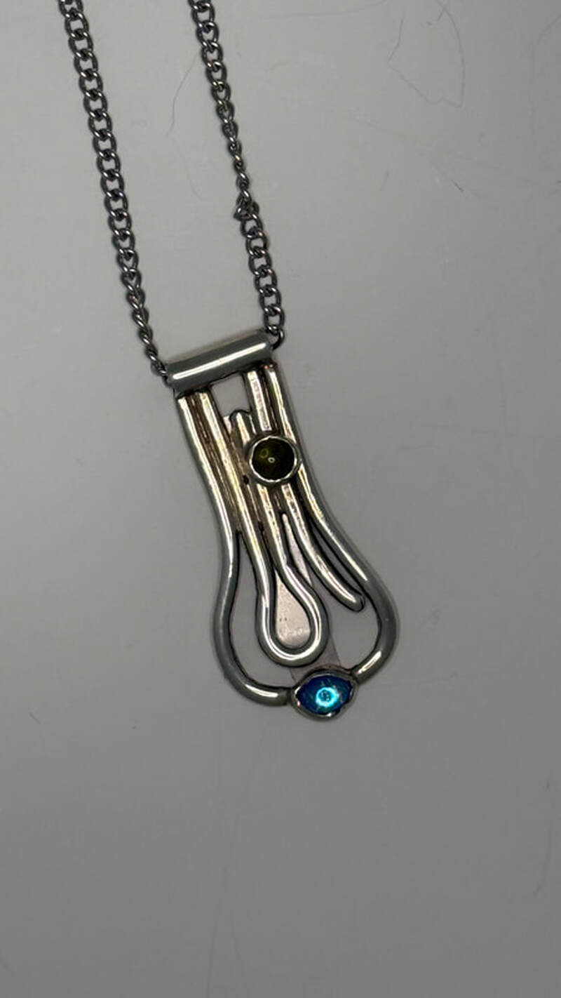 Sterling silver with green peridot and blue crystal, 20