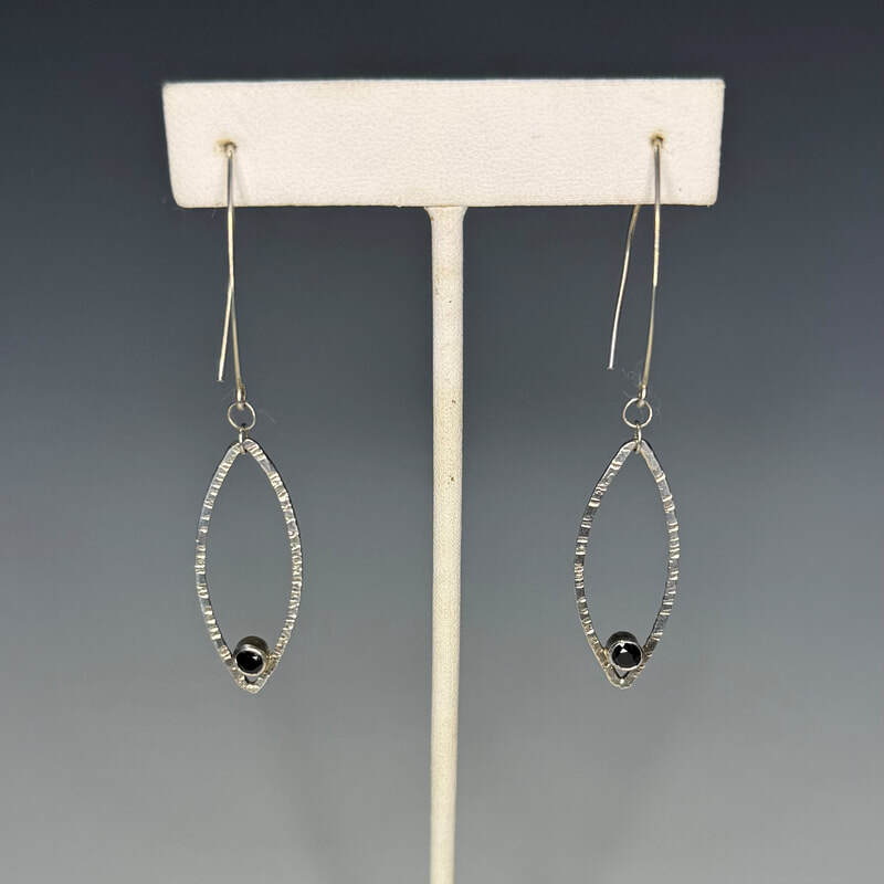 Hammered sterling with 4mm faceted black spinel. 2 3/4