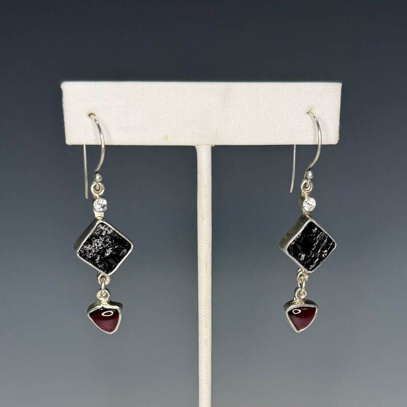 Natural surface black tourmaline with 8mm trilliant garnets set in sterling and fine silver.  $235.00