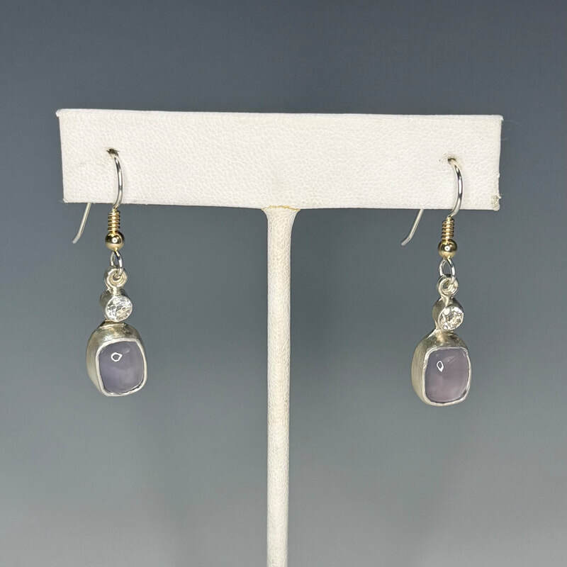 Holly blue chalcedony set in fine and sterling silvers with white topaz accents, sterling and 14k gold ear wires. $285.00