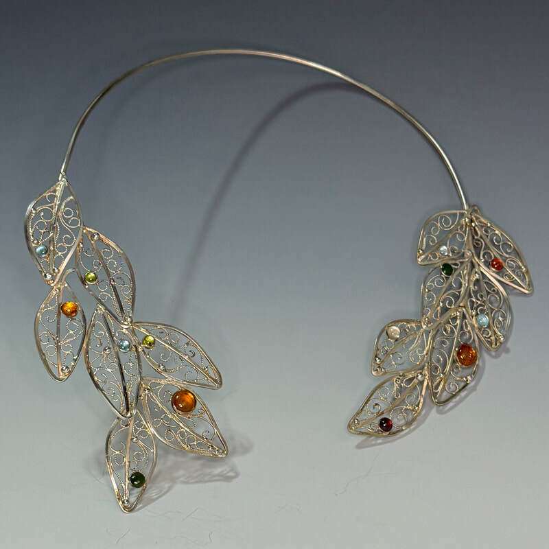 Russian filigree sterling with amber, moonstone, ruby, swiss bue topaz, carnelian, and nephrite jade   . $420.00